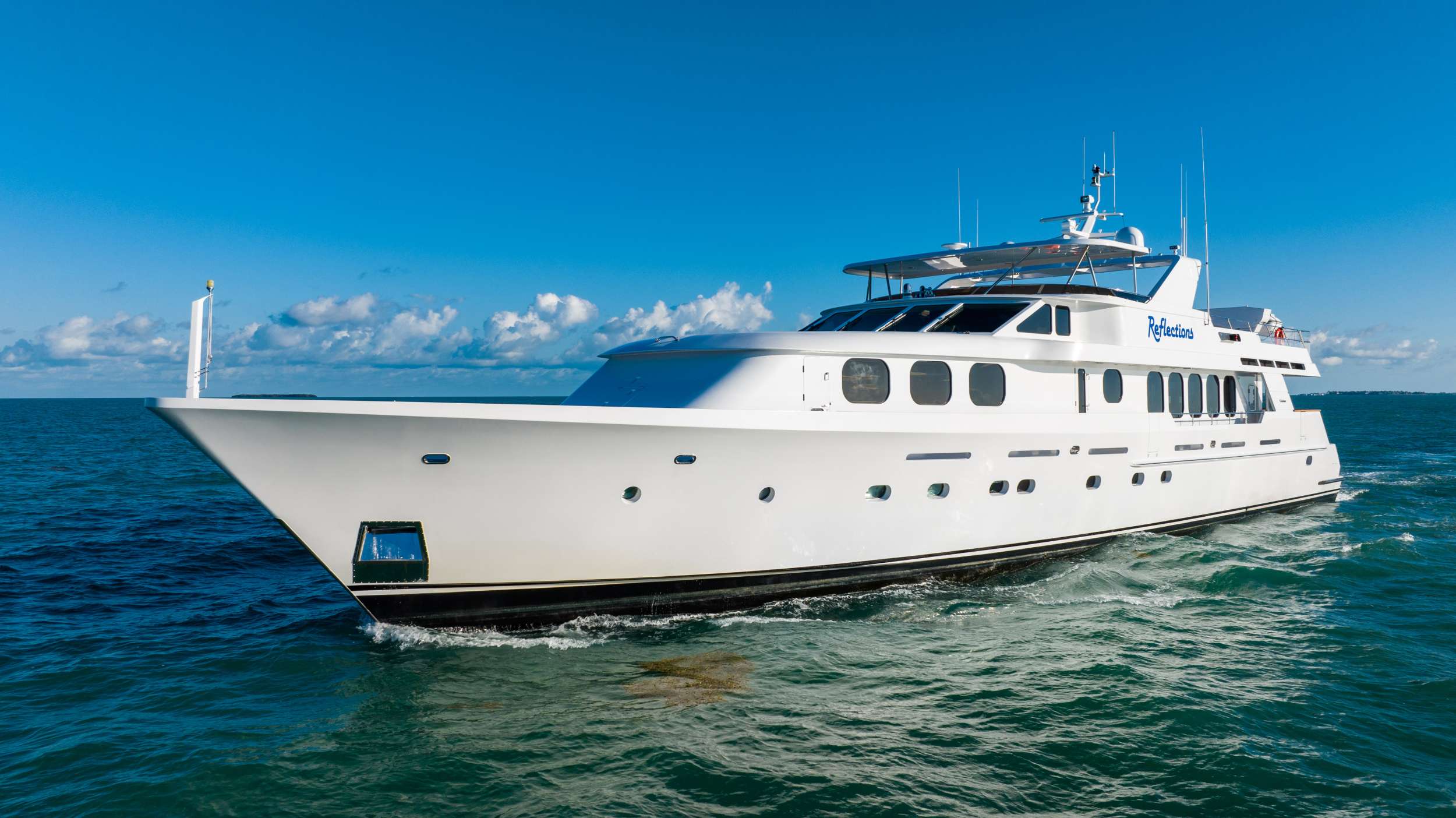 Reflections Luxury Crewed Christensen 124 Motoryacht Charter Cruising the Bahamas.