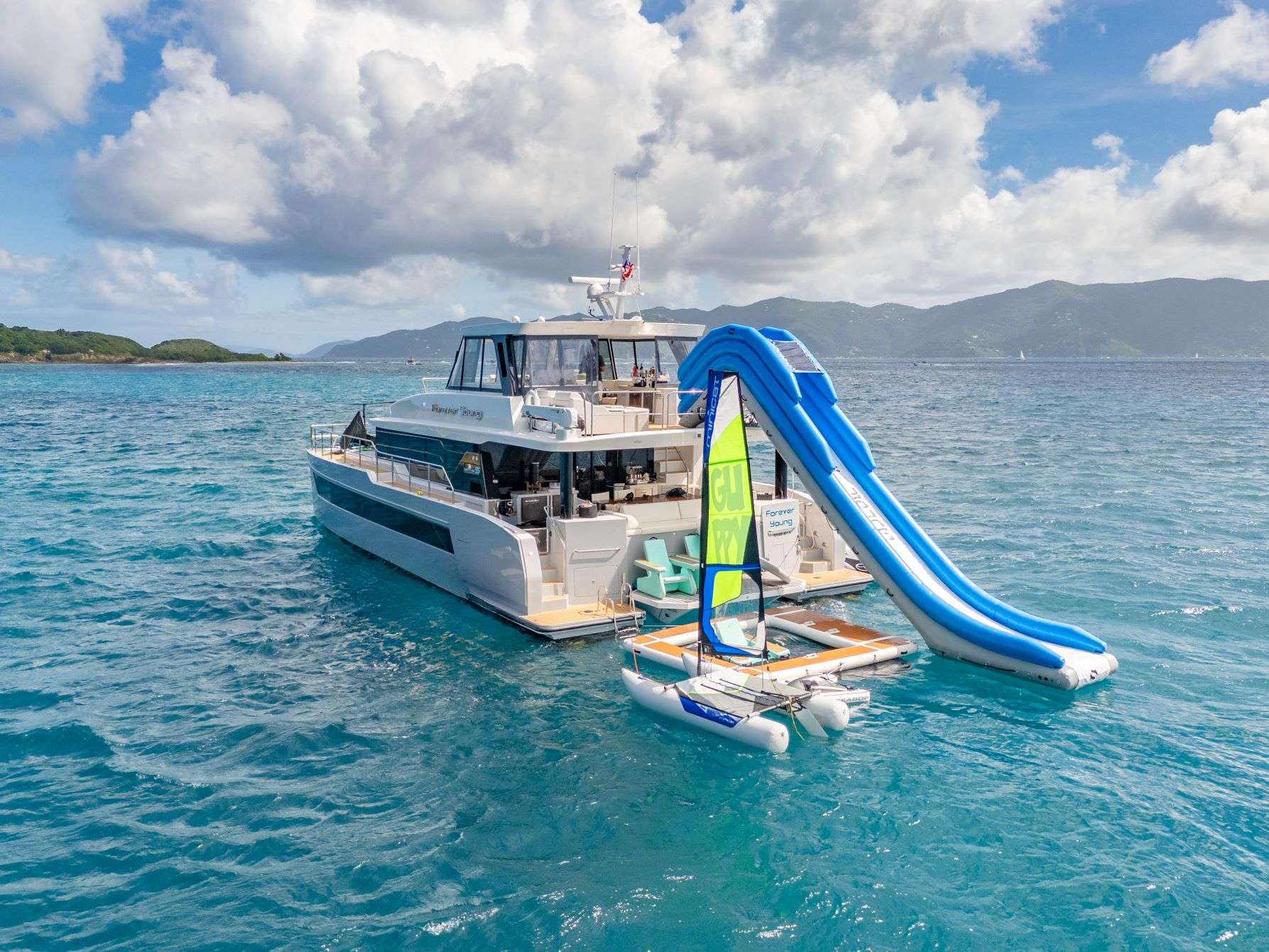 Forever Young Crewed Two Oceans 555 Powercat Charter Cruising the BVI